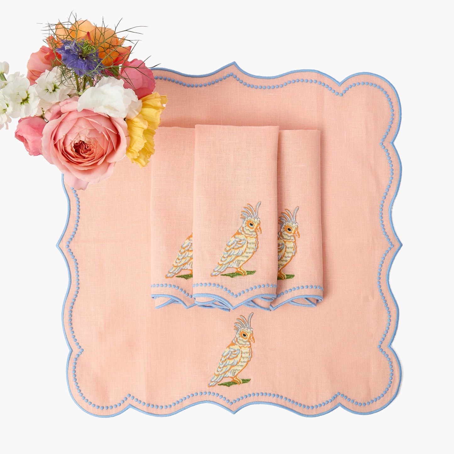 Sets de table et serviettes perroquet en lin corail et bleu Eloise (lot de 4)