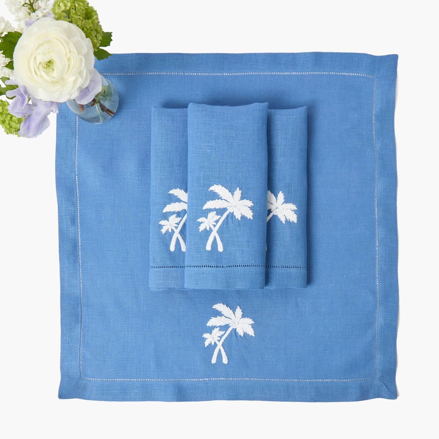 Sets de table et serviettes palmiers en lin bleu Eloise (lot de 4)