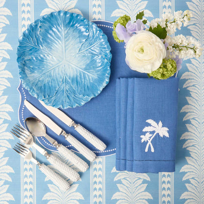 Sets de table et serviettes palmiers en lin bleu Eloise (lot de 4)