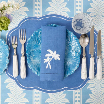 Sets de table et serviettes palmiers en lin bleu Eloise (lot de 4)