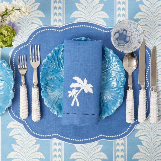 Sets de table et serviettes palmiers en lin bleu Eloise (lot de 4)